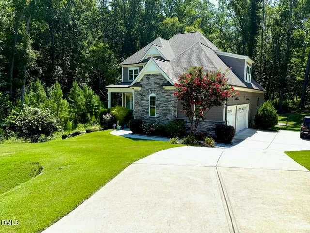 a house view with a garden space