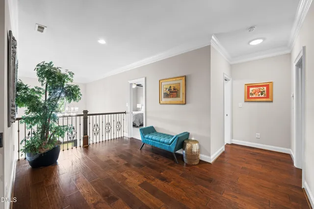 a en suite bathroom with a granite countertop sink and a mirror