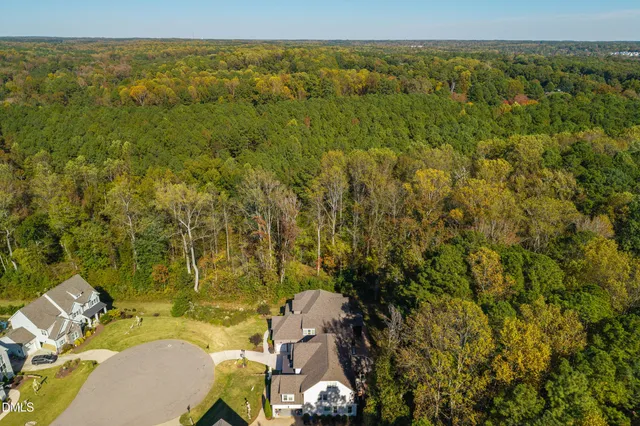 a picture of a kitchen with cabinets and refrigerator