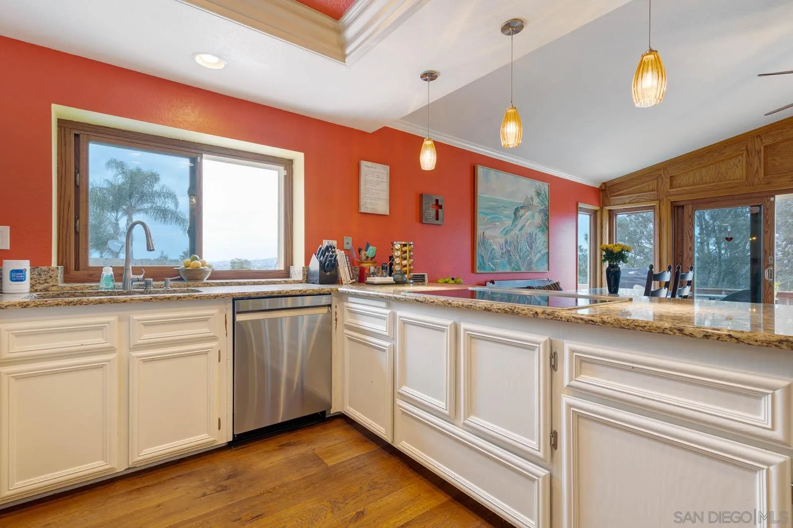 421 Via Savoy Encinitas, CA 92024 - Photo 12 of 37 a large white kitchen with a large window