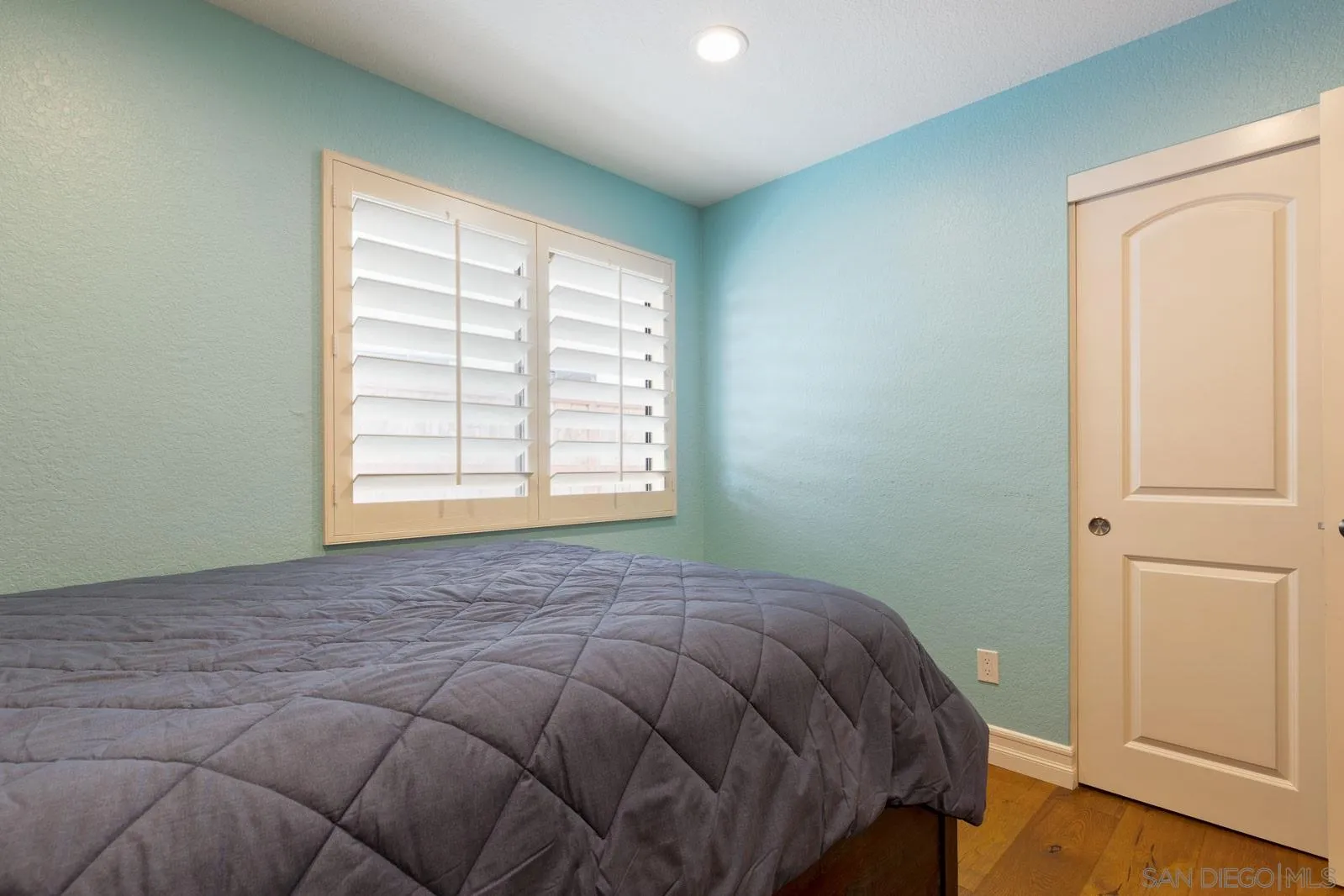 421 Via Savoy Encinitas, CA 92024 - Photo 22 of 37 a bed sitting in a bedroom next to a window