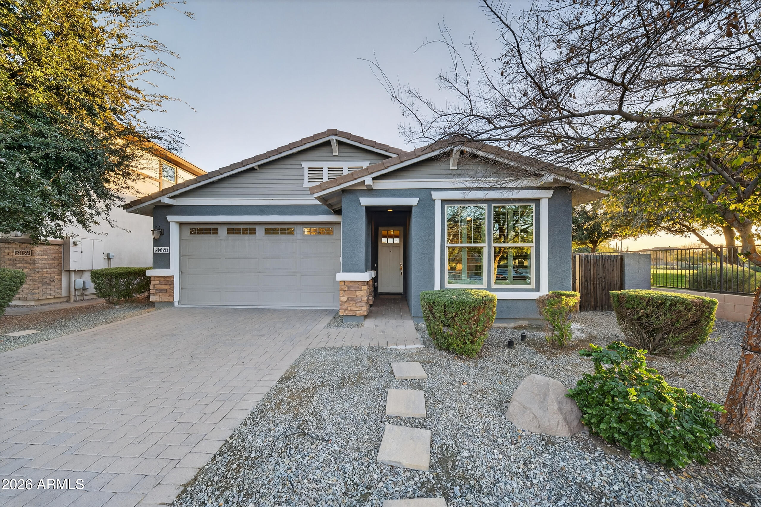 5067 South Girard Street Gilbert, AZ 85298 - Photo 1 of 15 a front view of a house with garden