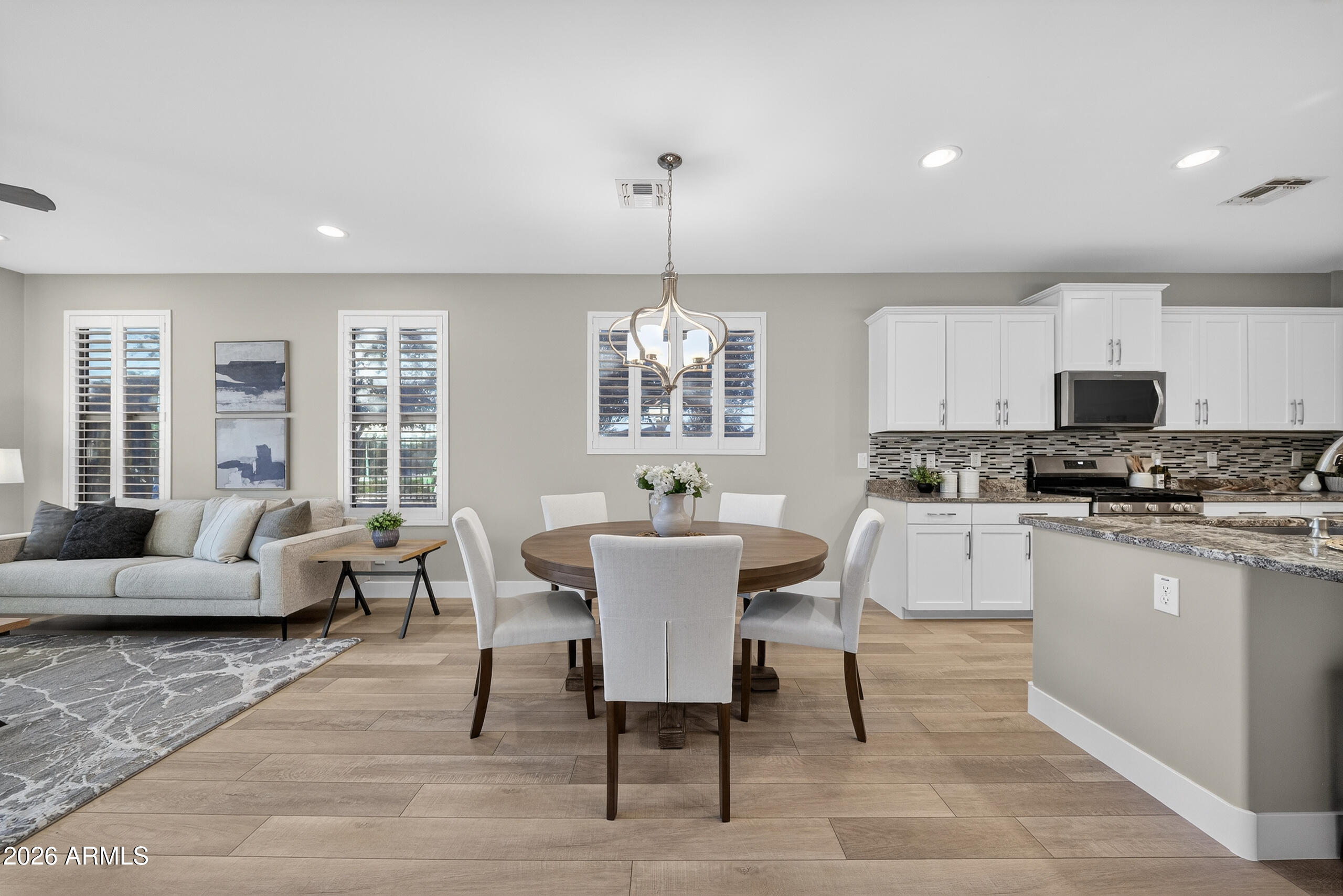 5067 South Girard Street Gilbert, AZ 85298 - Photo 5 of 15 a view of a dining room with furniture window and wooden floor