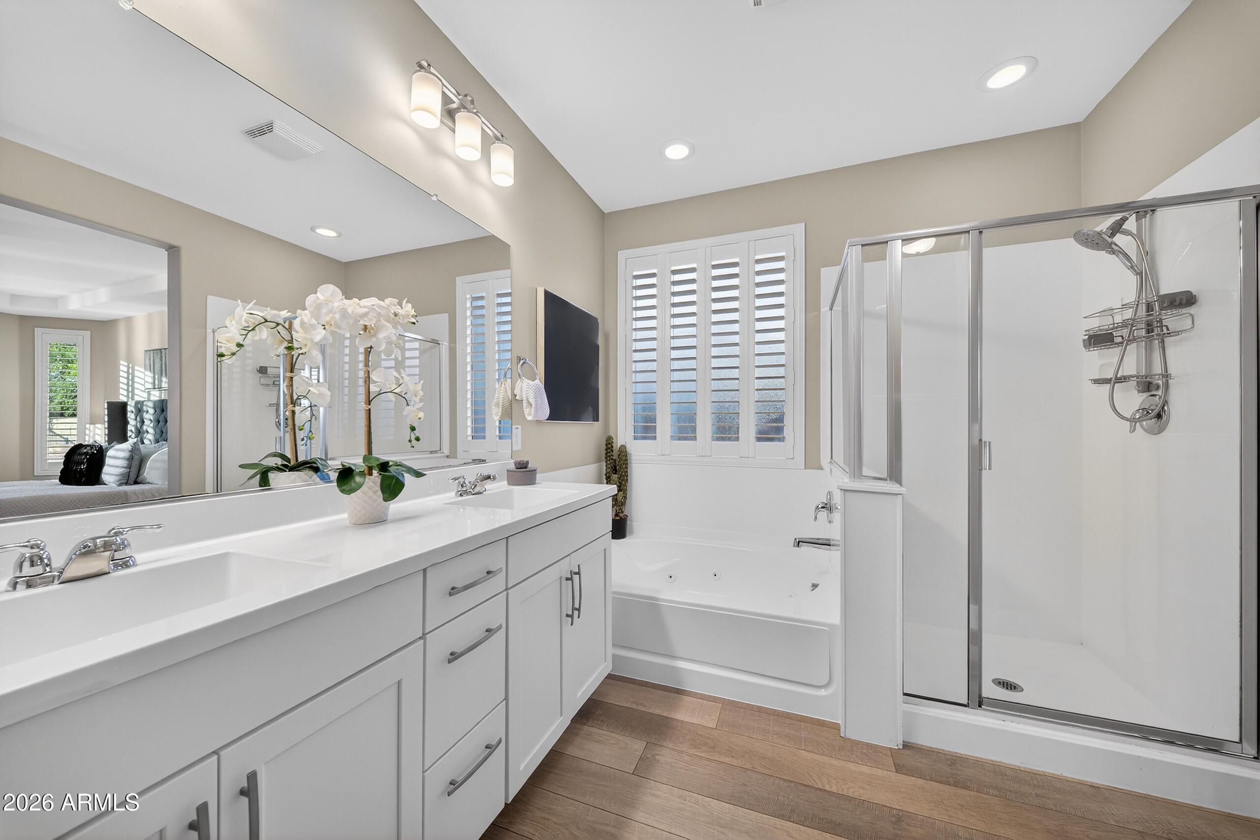 5067 South Girard Street Gilbert, AZ 85298 - Photo 8 of 15 a spacious bathroom with double vanity a large mirror and a shower