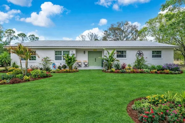 a view of a house with garden