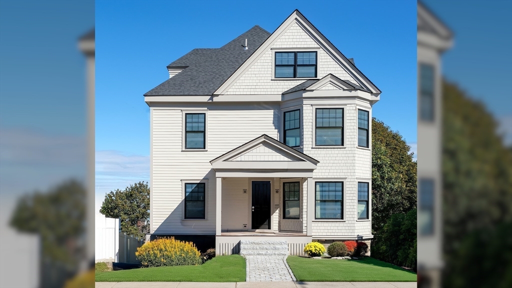 142 Metropolitan Avenue, Unit 2 Boston, MA 02131 - Photo 12 of 13 a front view of a house with garden