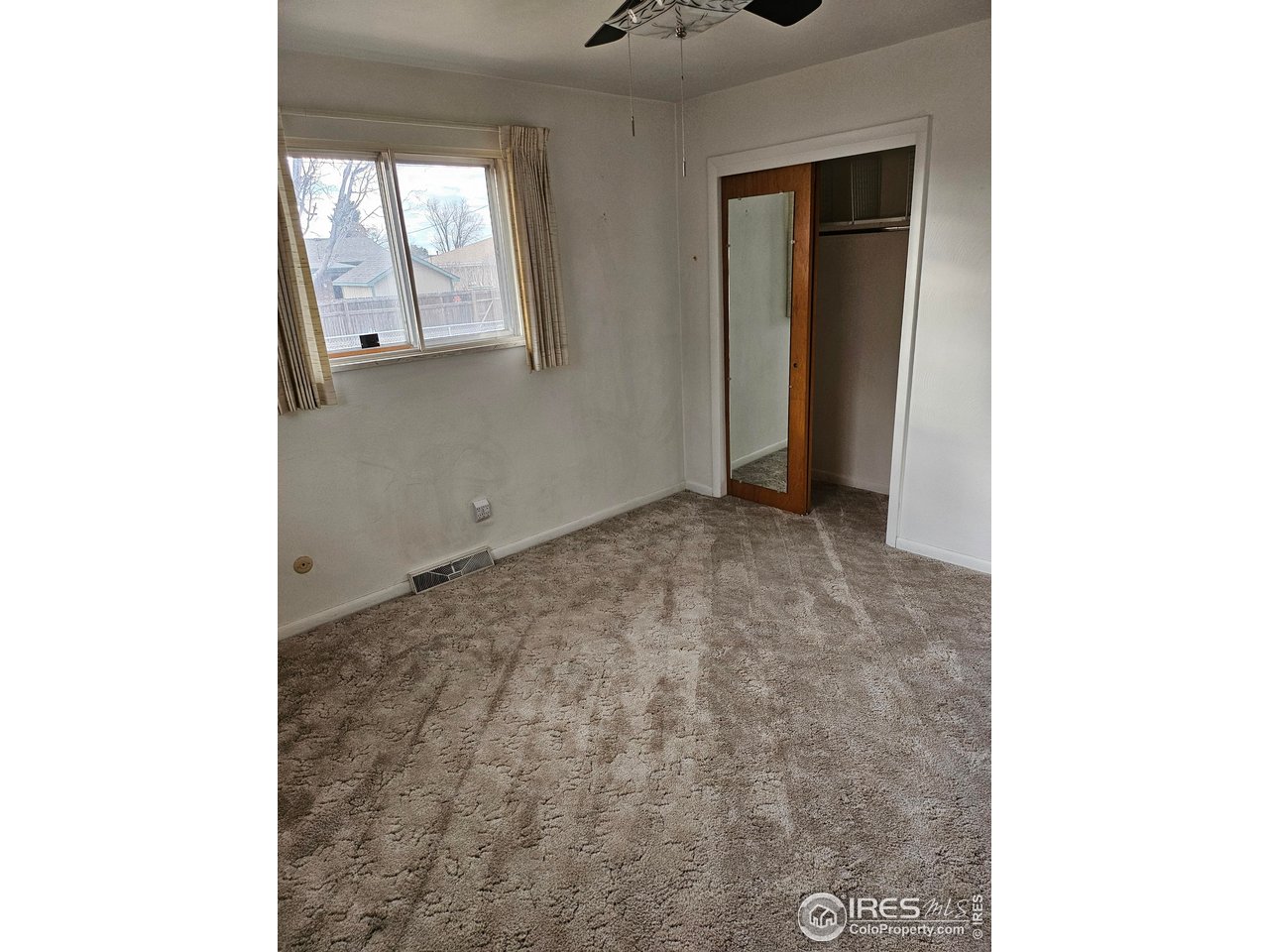 425 35th Court Greeley, CO 80634 - Photo 12 of 36 a view of an empty room with windows