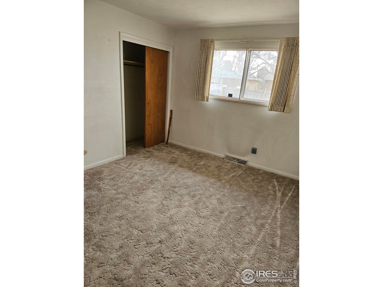 425 35th Court Greeley, CO 80634 - Photo 13 of 36 a view of an empty room with window