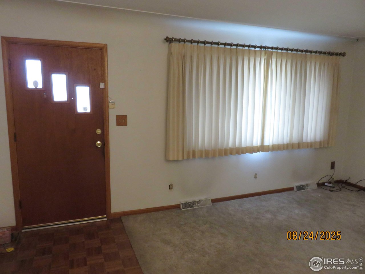 425 35th Court Greeley, CO 80634 - Photo 3 of 36 an empty room with a window