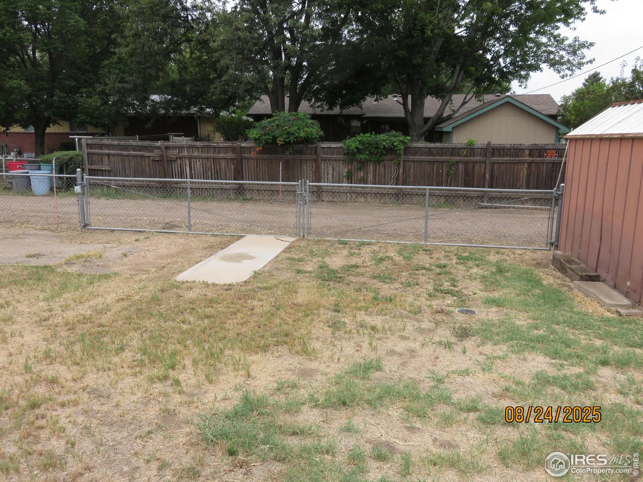 425 35th Court Greeley, CO 80634 - Photo 34 of 36 a view of a yard with wooden fence