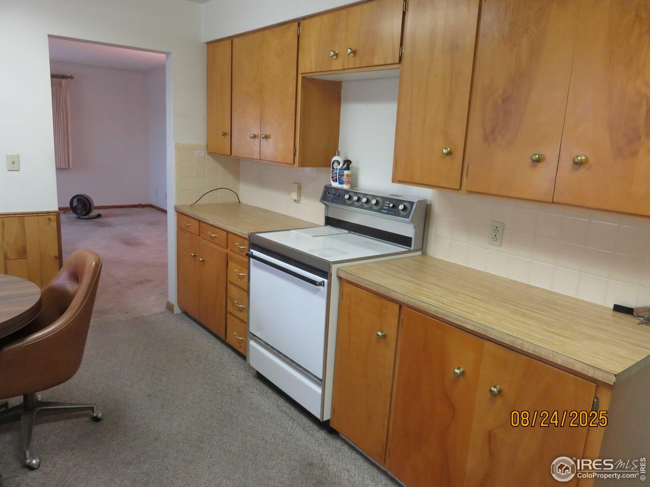 425 35th Court Greeley, CO 80634 - Photo 7 of 36 a kitchen that has a sink and a stove in it