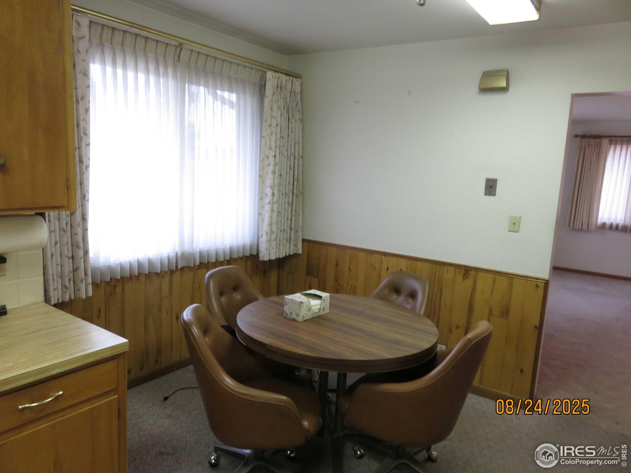 425 35th Court Greeley, CO 80634 - Photo 8 of 36 a view of a dining room with furniture and window