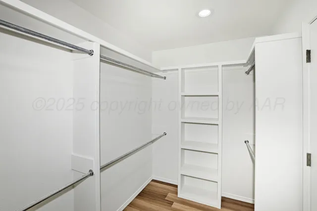 a view of an empty walk in closet