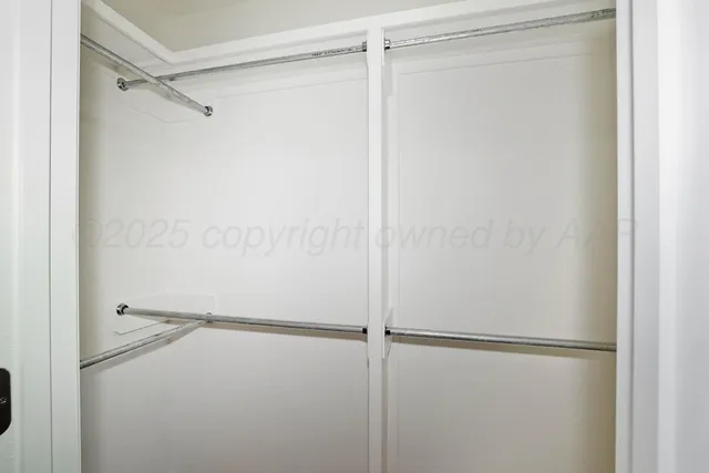 a view of an empty walk in closet