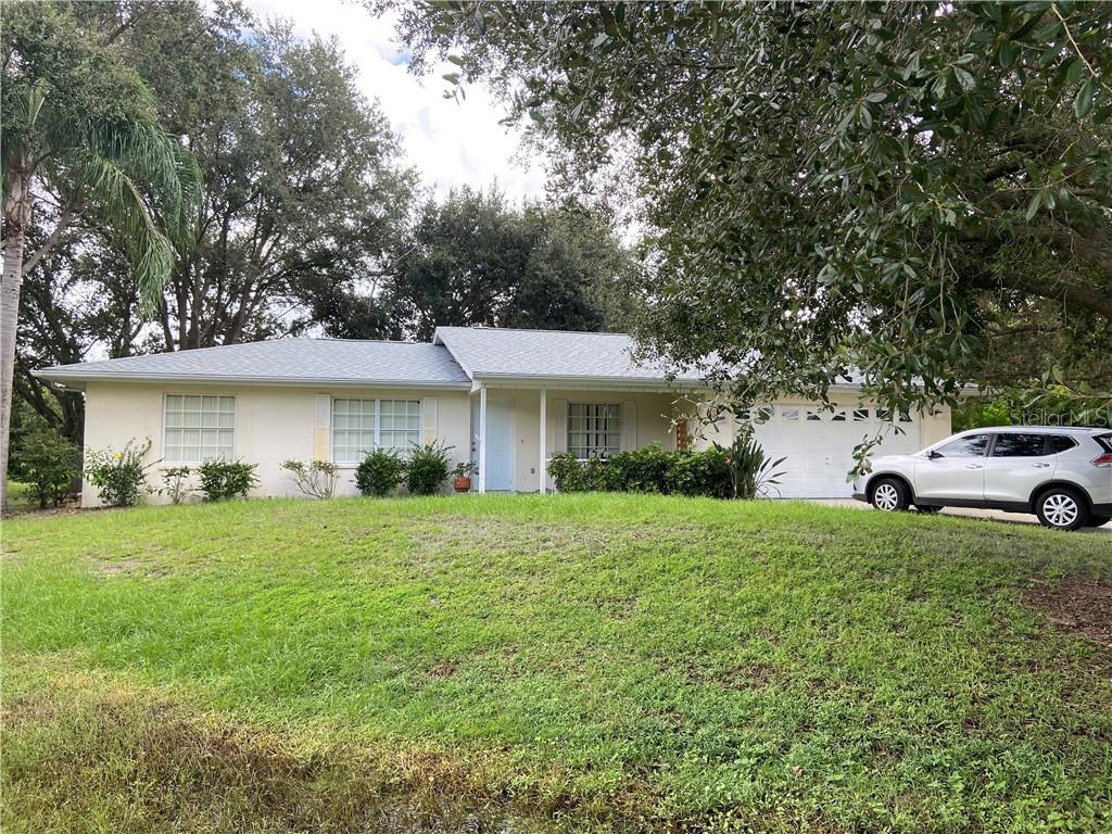 New roof, new a/c and "x" flood zone are key factors in this darling ranch.  In need of some tender TLC in cosmetics, it has a great split floor plan and a park-like lot.  This diamond in the rough is a great by!