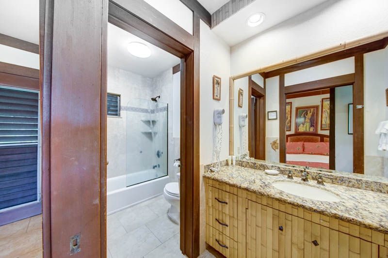 2253 Poipu Road, Unit 178 Koloa, HI 96756 - Photo 13 of 26 a bathroom with a granite countertop sink and a mirror