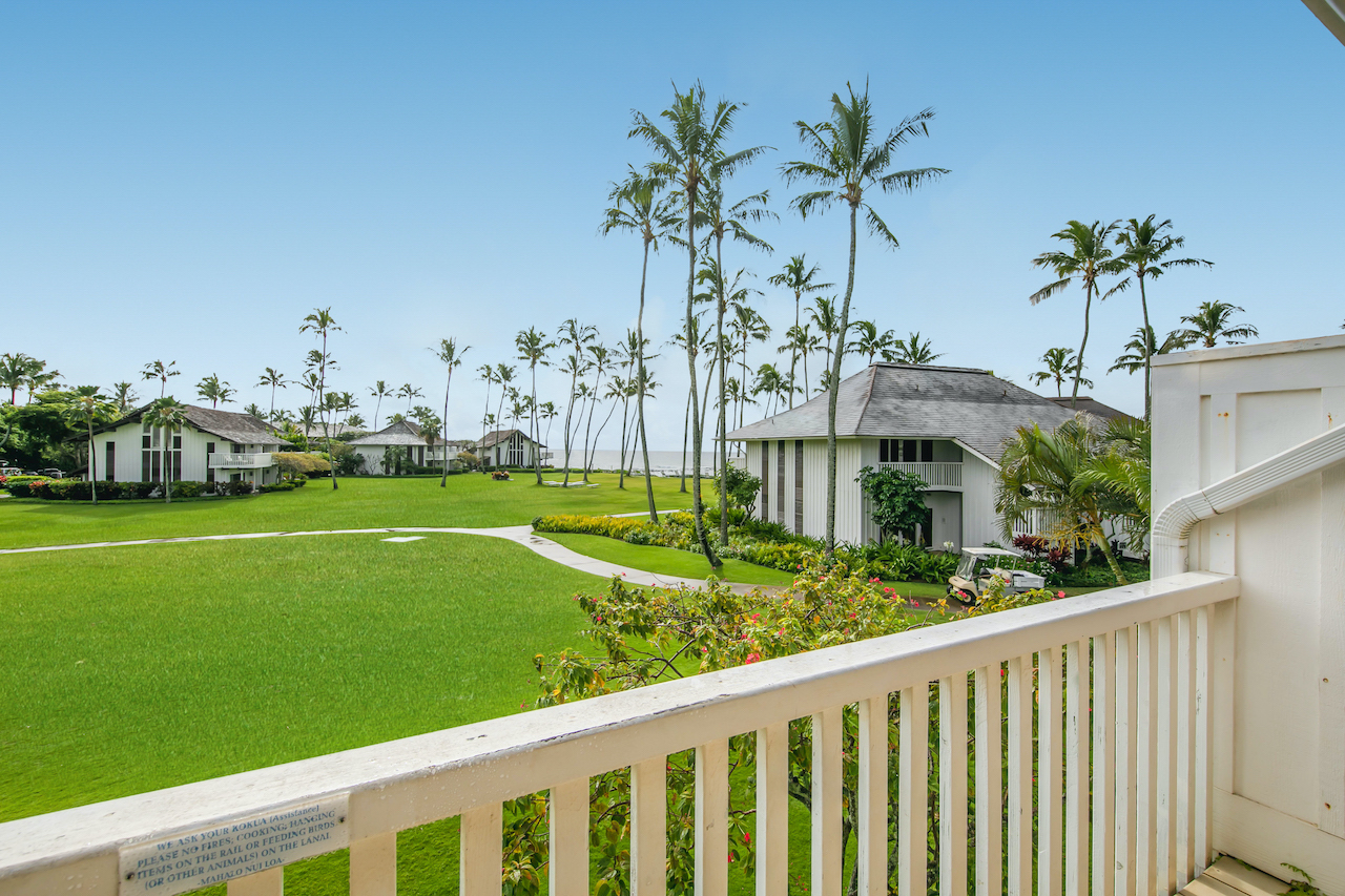 2253 Poipu Road, Unit 178 Koloa, HI 96756 - Photo 8 of 26 a view of a house with a yard and potted plants