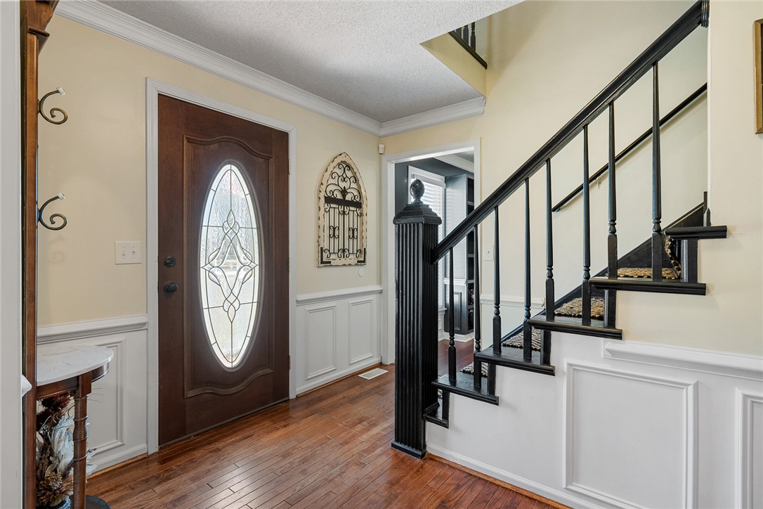 112 C-10-220 Anderson, SC 29621 - Photo 3 of 45 This entry features rich hardwood floors and a striking staircase.