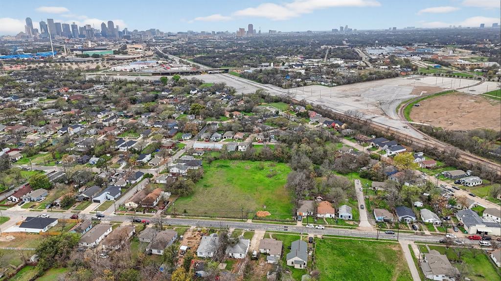 4723 Collins Avenue Dallas, TX 75210 - Photo 9 of 18 an aerial view of residential houses with outdoor space and trees