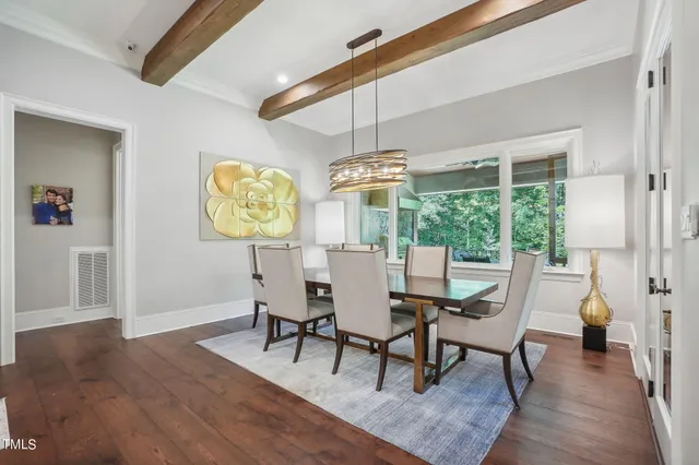 a view of a workspace with furniture and a chandelier