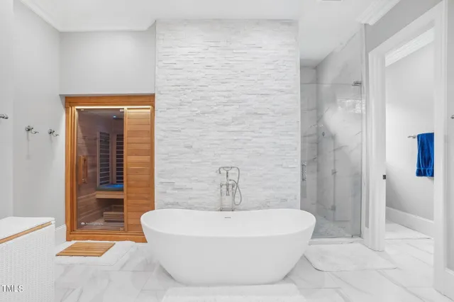 a bedroom with a bed and a night stand