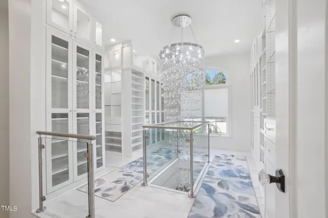 a bathroom with a sink a vanity a mirror and shower