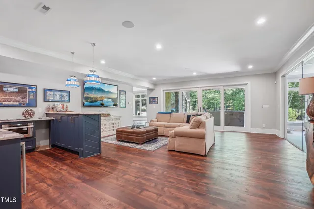 an aerial view of a house with a lake view