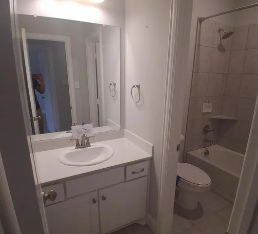 a bathroom with a toilet and a bathtub