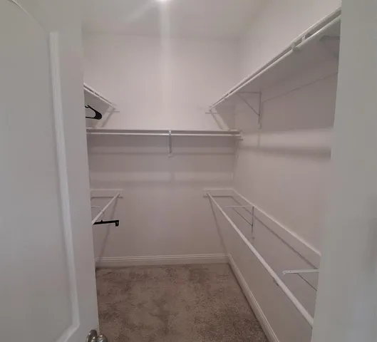 a view of small space with racks on the wall