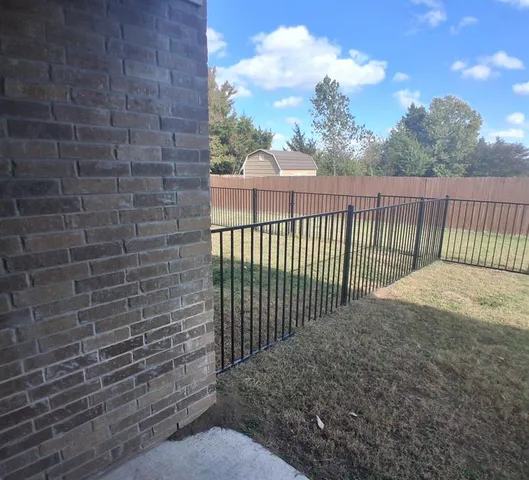 a view of a wrought fence