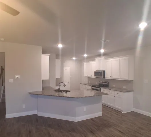 a view of kitchen with counter top space and appliances