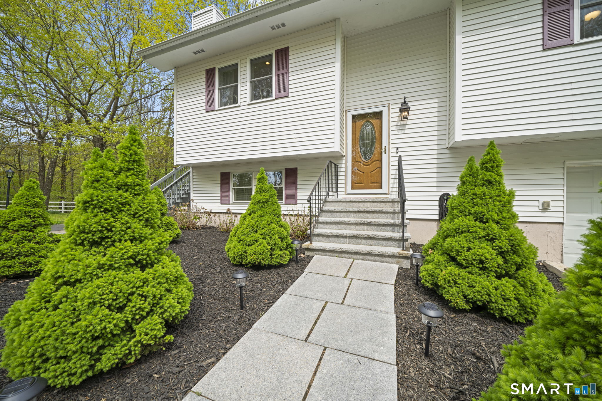 1118 Spindle Hill Road Wolcott, CT 06716 - Photo 3 of 38 a front view of a house with garden