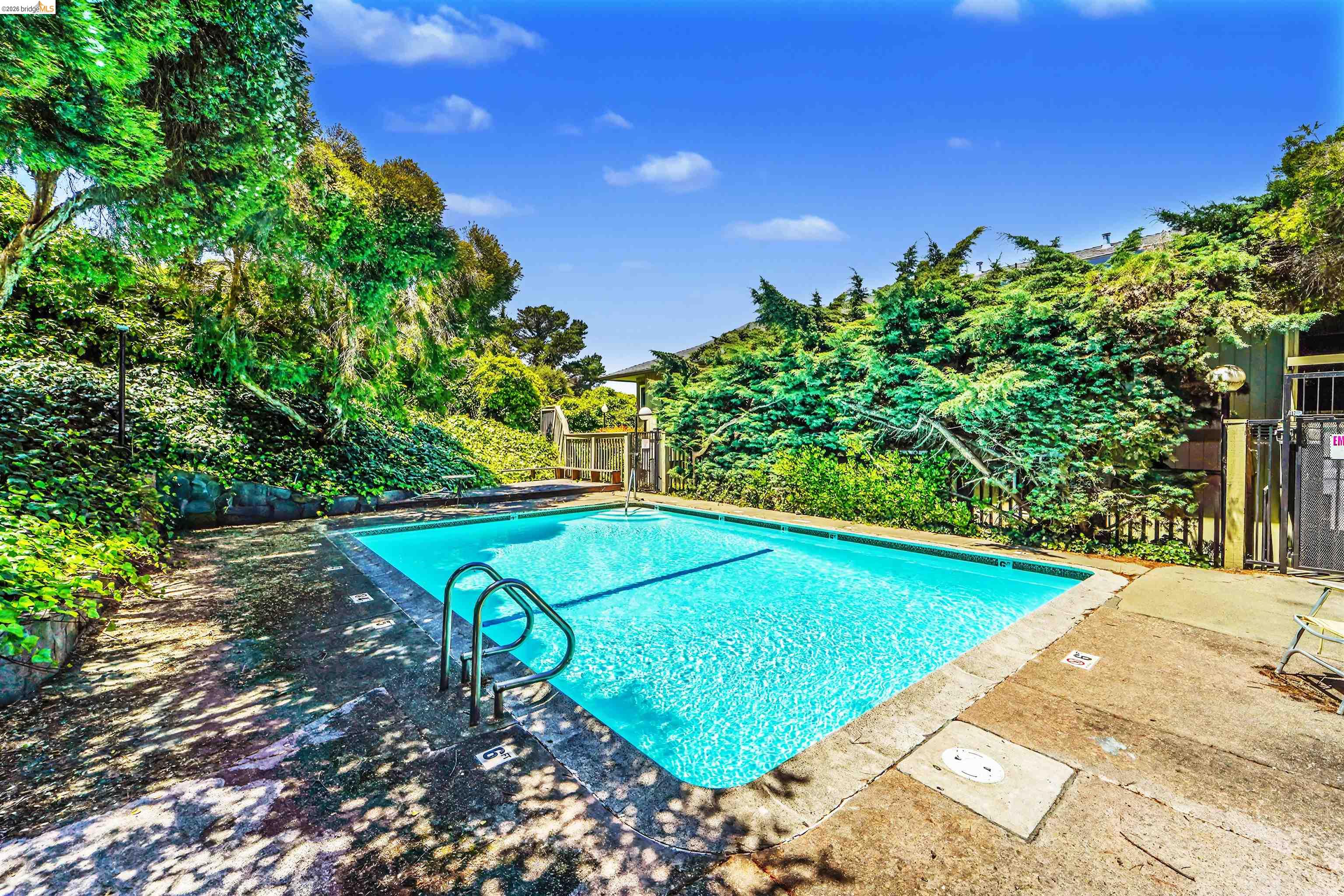 4186 San Pablo Dam Road, Unit A El Sobrante, CA 94803 - Photo 31 of 34 Rectangular swimming pool with integrated metal handrails