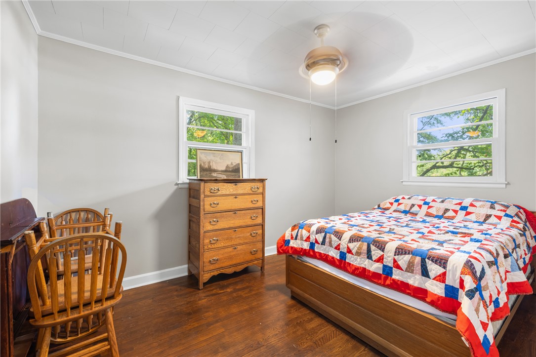308 Buchanan Circle Pendleton, SC 29670 - Photo 13 of 19 This cozy bedroom features durable hardwood flooring and ample natural light from two large windows.