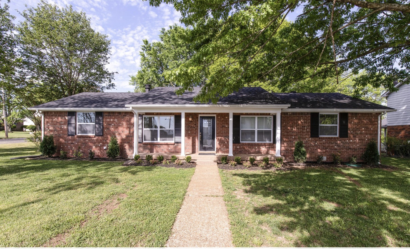 front view of a house with a yard