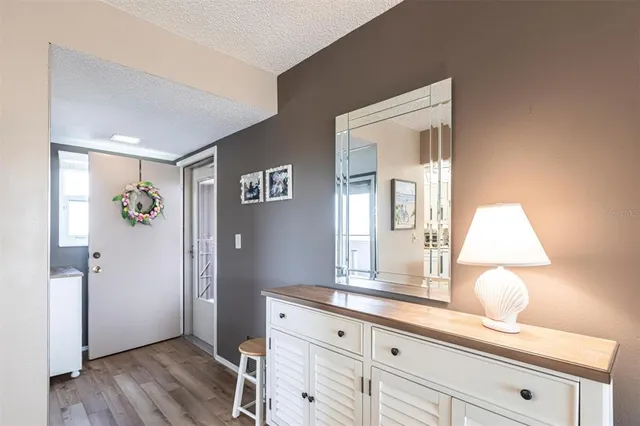 a spacious bathroom with a granite countertop sink and a mirror