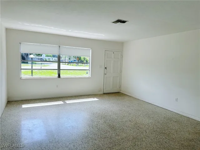 an empty room with a window