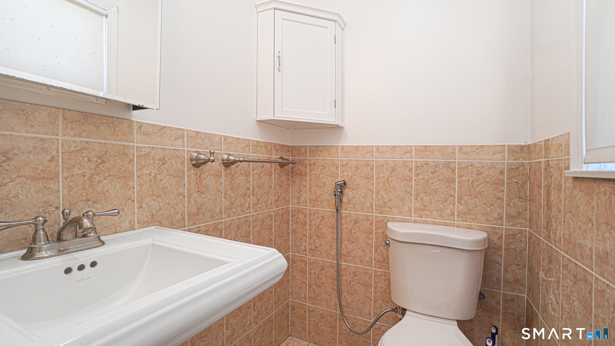 997 Meriden Avenue Southington, CT 06489 - Photo 11 of 24 a bathroom with a sink a toilet and a shower