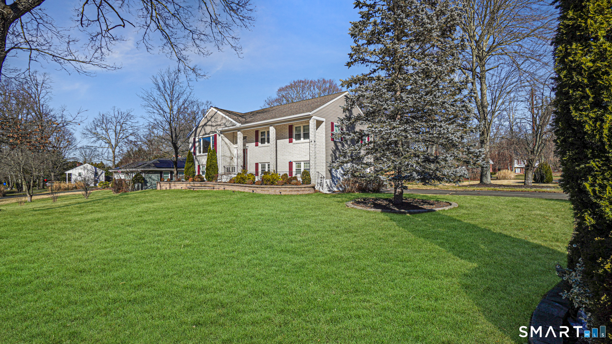 997 Meriden Avenue Southington, CT 06489 - Photo 2 of 24 a front view of a house with a garden
