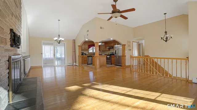 a view of a living room and a ceiling fan floor