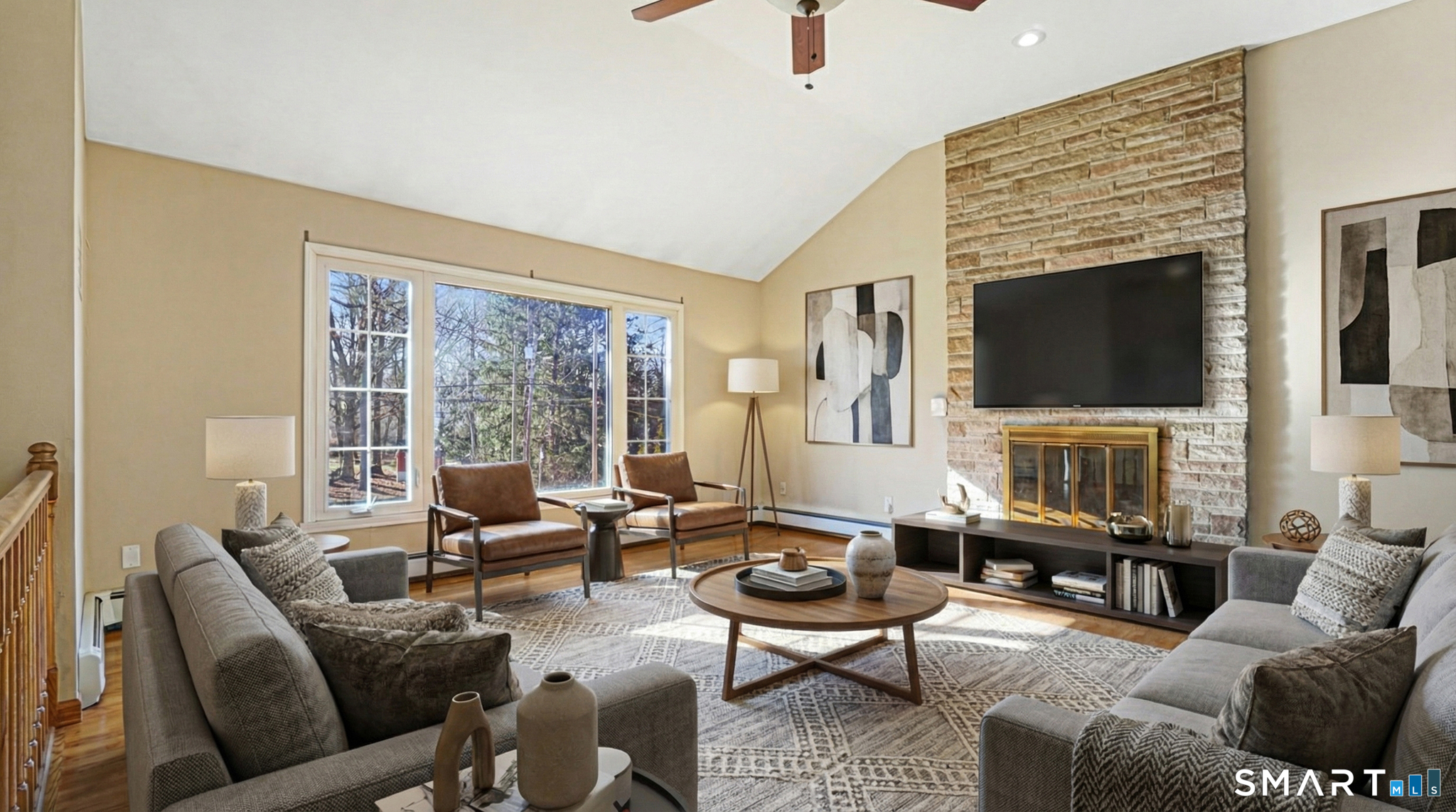 997 Meriden Avenue Southington, CT 06489 - Photo 4 of 24 a living room with furniture a fireplace and a flat screen tv