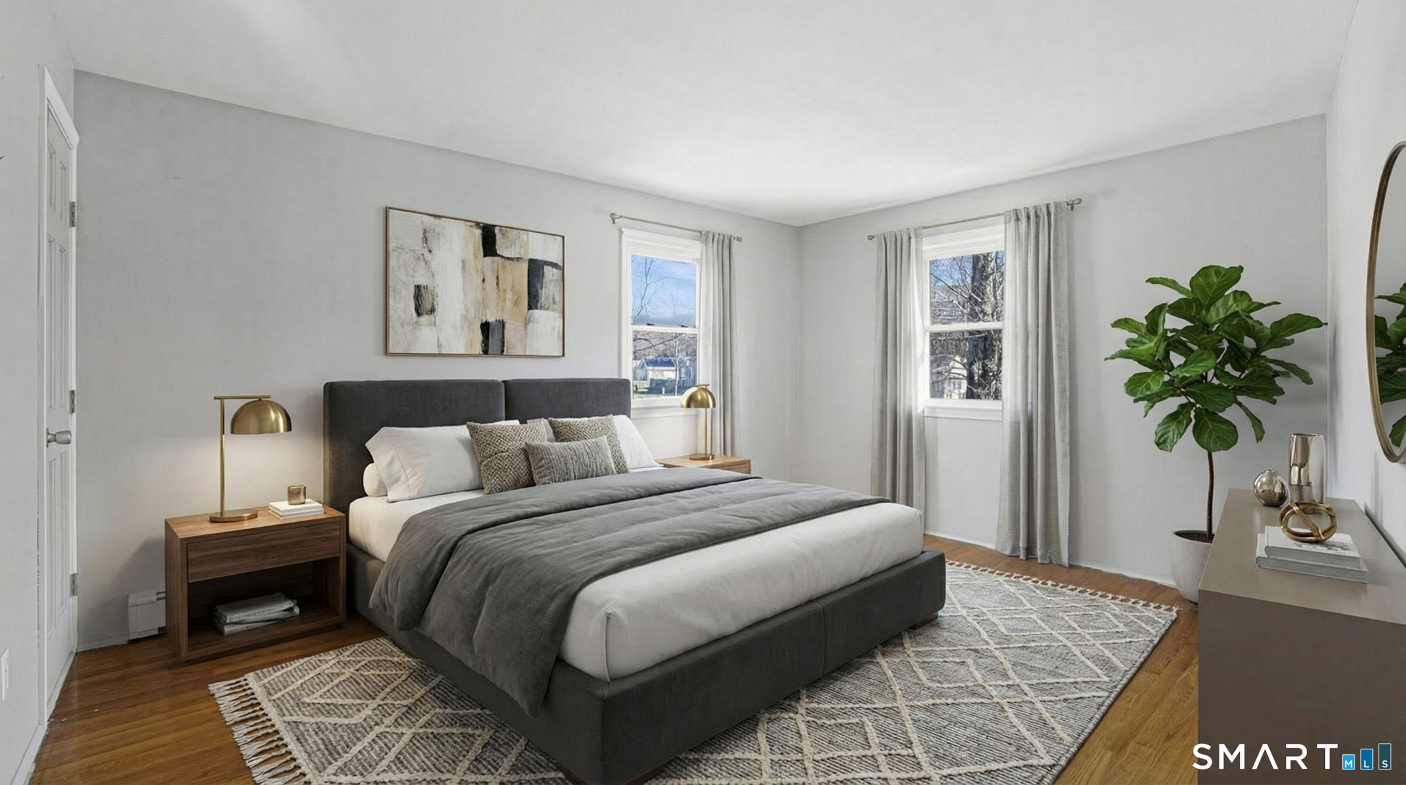 997 Meriden Avenue Southington, CT 06489 - Photo 7 of 24 a bedroom with a large bed and a potted plant