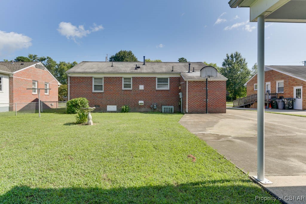3204 West Weaver Road Hampton, VA 23666 - Photo 25 of 27 Back of house with central air condition unit and a yard