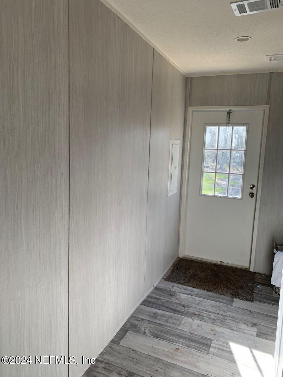 45131 Browns Farm Road Callahan, FL 32011 - Photo 32 of 35 a view of an empty room with wooden floor and a window