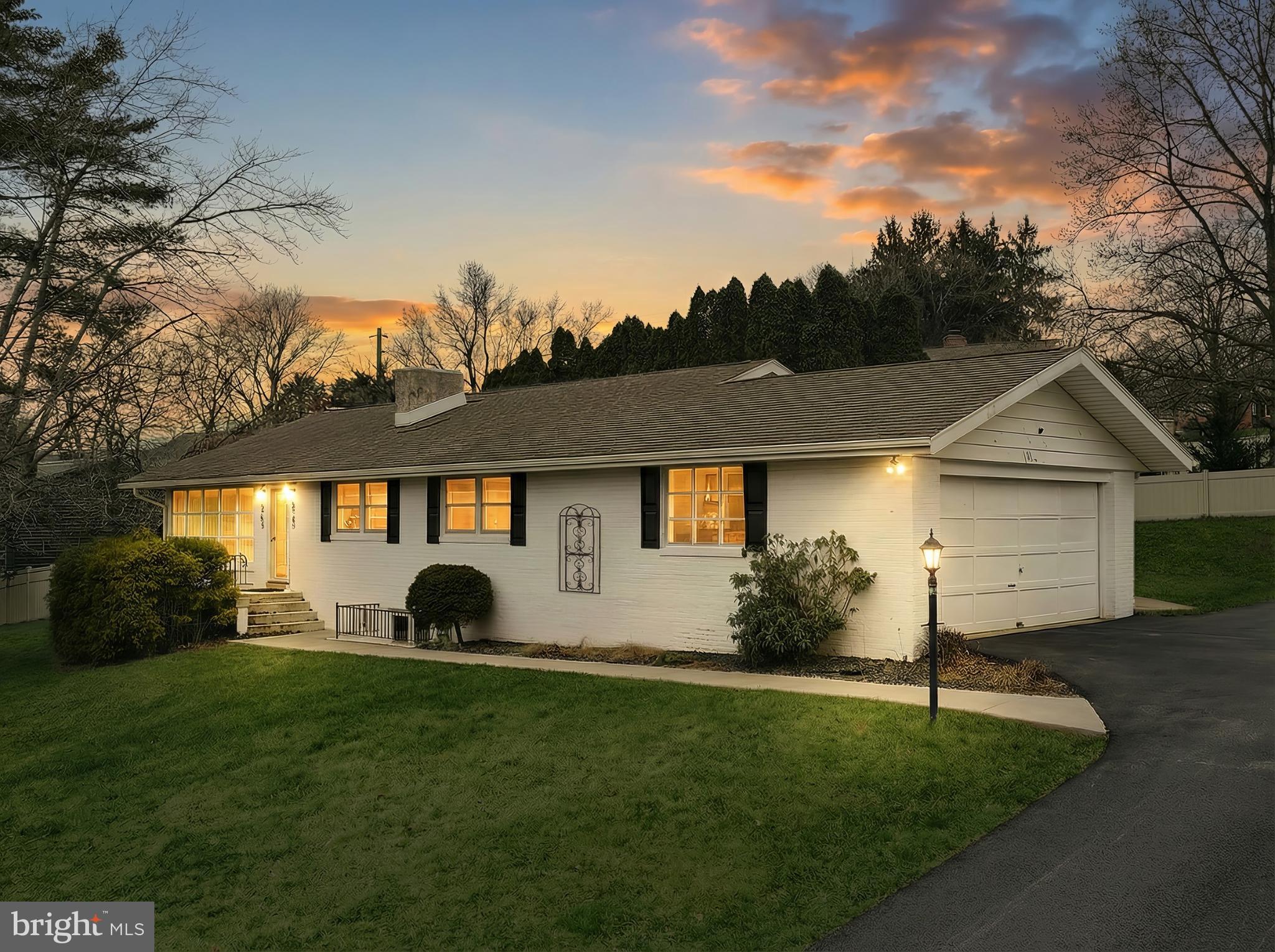 Charming home bathed in sunset glow.