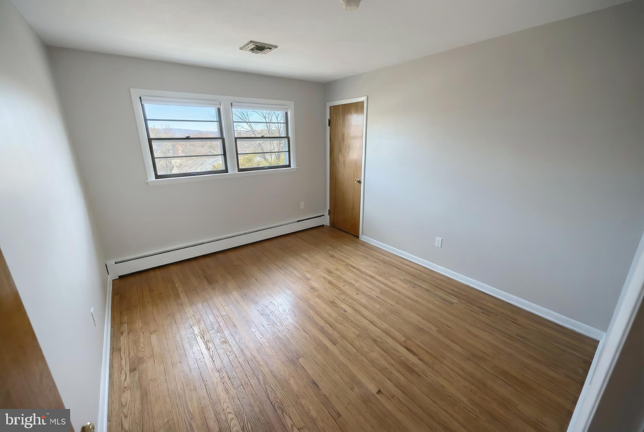 1615 Crestlyn Road York, PA 17403 - Photo 21 of 46 Bright and airy room with hardwood floors.