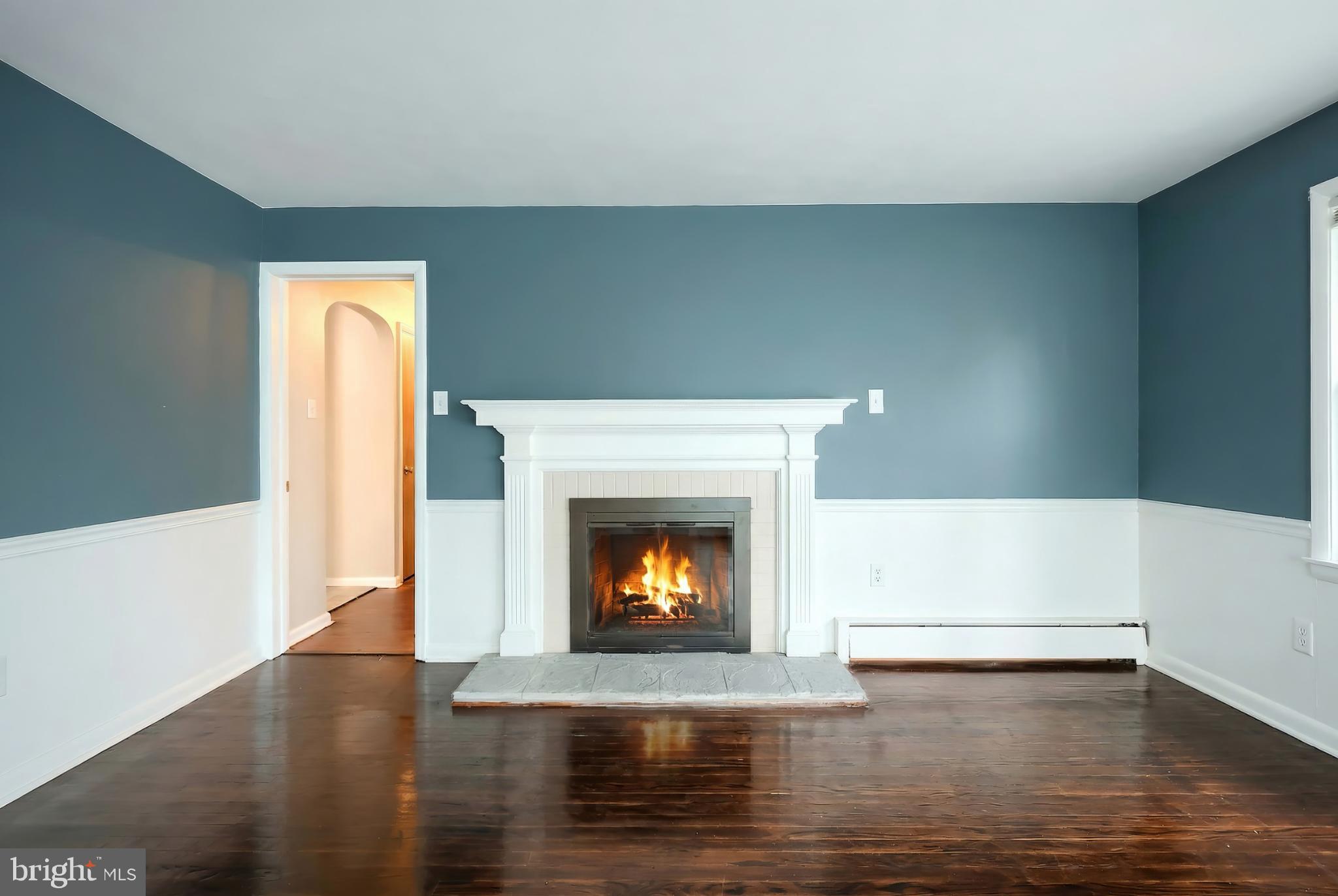 1615 Crestlyn Road York, PA 17403 - Photo 26 of 46 Cozy living space with a welcoming fireplace.