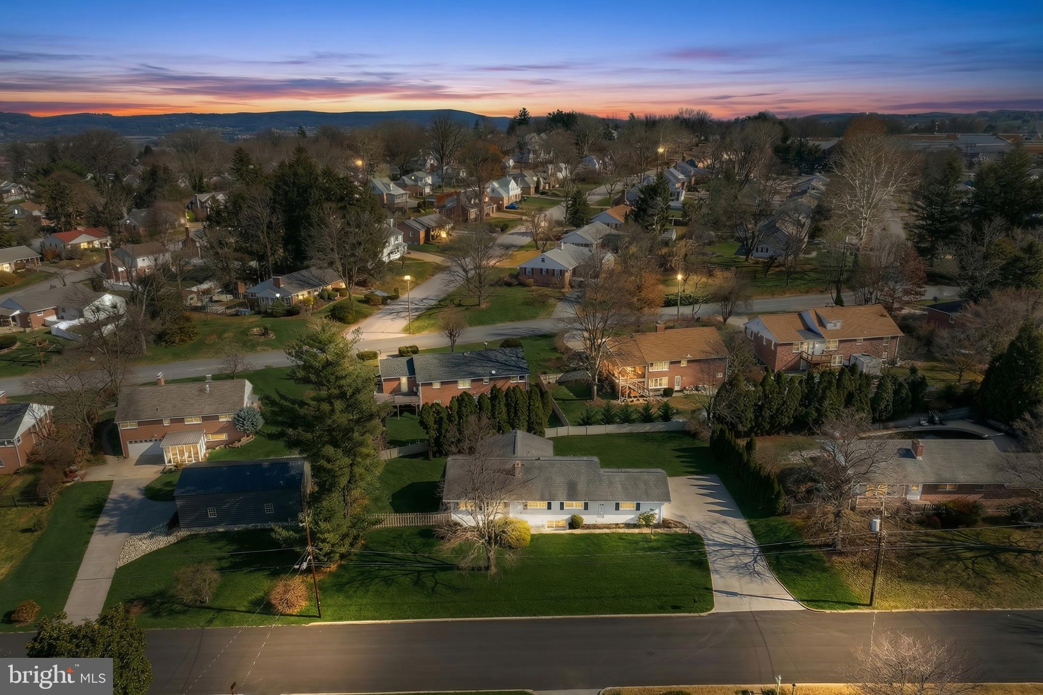 1615 Crestlyn Road York, PA 17403 - Photo 4 of 46 Serene suburban sunset over cozy homes.
