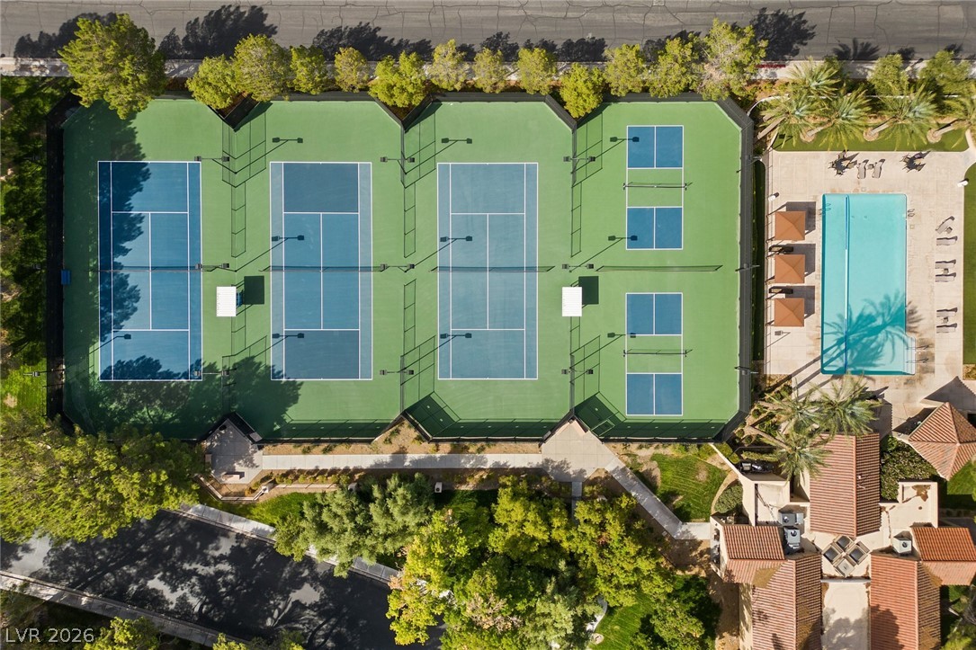 20 Innisbrook Avenue Las Vegas, NV 89113 - Photo 39 of 39 An aerial perspective showcases the well-maintained tennis courts, pickleball courts, and refreshing swimming pool within the community.