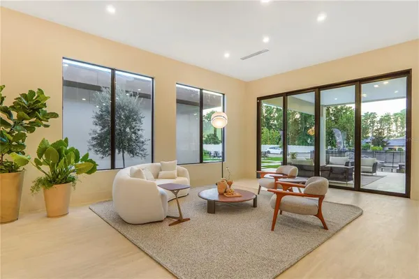 a bedroom with a large bed and a large window